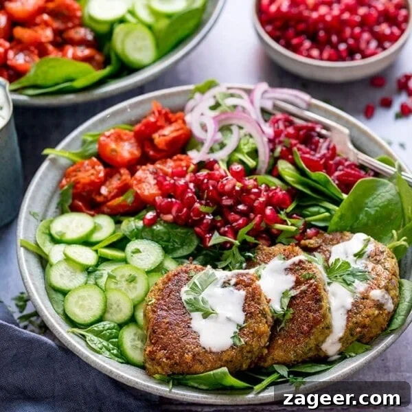 Spicy Chicken Power Bowl with Avocado & Lime Rice 12 Salad bowl with falafel and feta dressing in a grey bowl