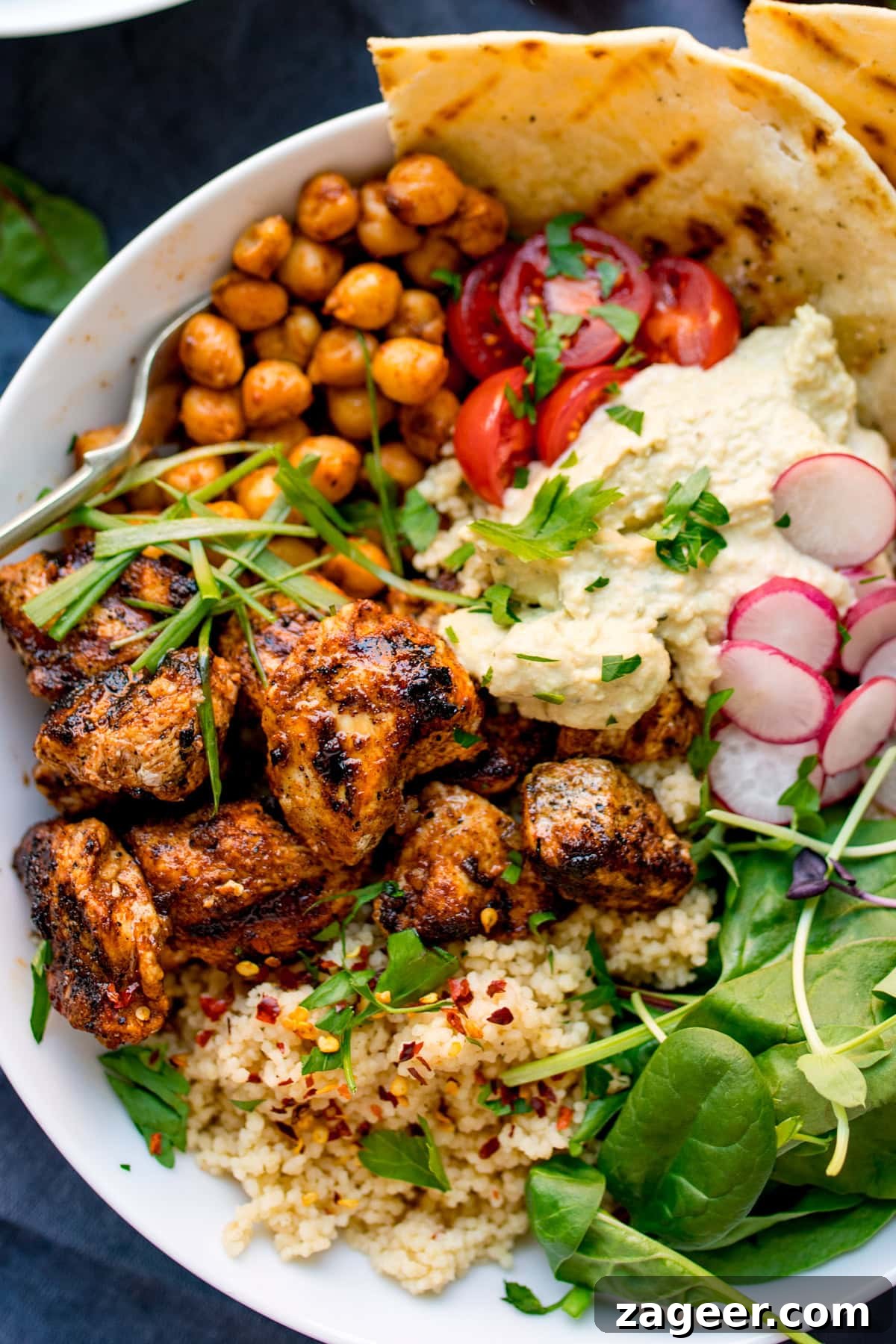 Spicy Chicken Power Bowl with Avocado & Lime Rice 6 spicy chicken, chickpeas, couscous, leaves, radish, hummus and flatbreads in a bowl