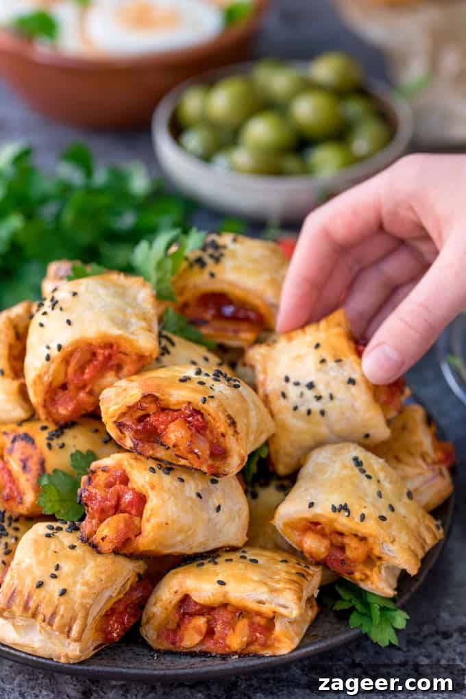 Chicken Chorizo Puff Pastry Rolls: Savory Baked Appetizer Recipe 2 Chicken Chorizo Puff Pastry Rolls - This easy snack uses leftover pasta sauce. Have spaghetti for dinner, and these pastry rolls for lunch the next day!