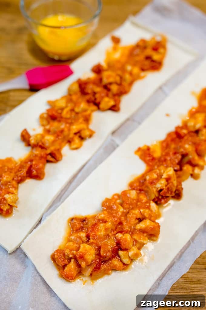 Chicken Chorizo Puff Pastry Rolls: Savory Baked Appetizer Recipe 4 Chicken Chorizo Puff Pastry Rolls - This easy snack uses leftover pasta sauce. Have spaghetti for dinner, and these pastry rolls for lunch the next day!