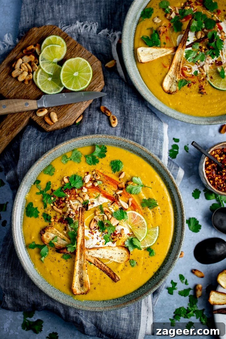 Spicy Parsnip and Sweet Potato Soup Recipe for Cozy Nights 2 overhead picture of Spicy Parsnip and Sweet Potato Soup in a dutch oven with some having been ladled out into a white bowl on a blue and white chequered table cloth