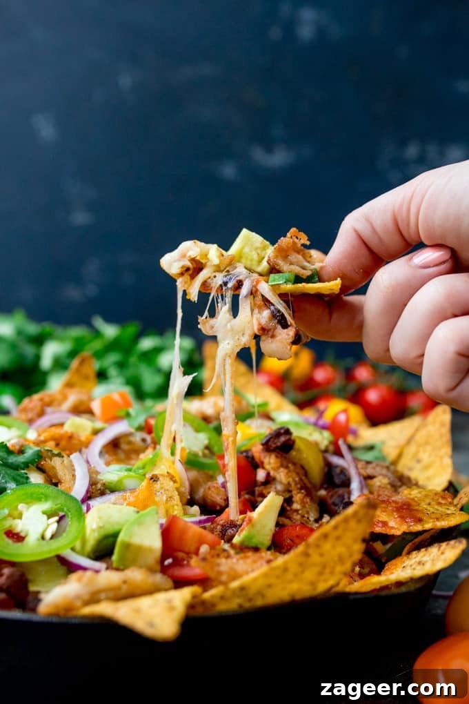 Crispy Turkey Nachos with Melted Cheese and Jalapeños 3 Crispy fajita-spiced turkey on nachos