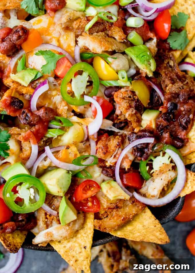 Crispy Turkey Nachos with Melted Cheese and Jalapeños 5 Stacked nachos topped with turkey and cheese