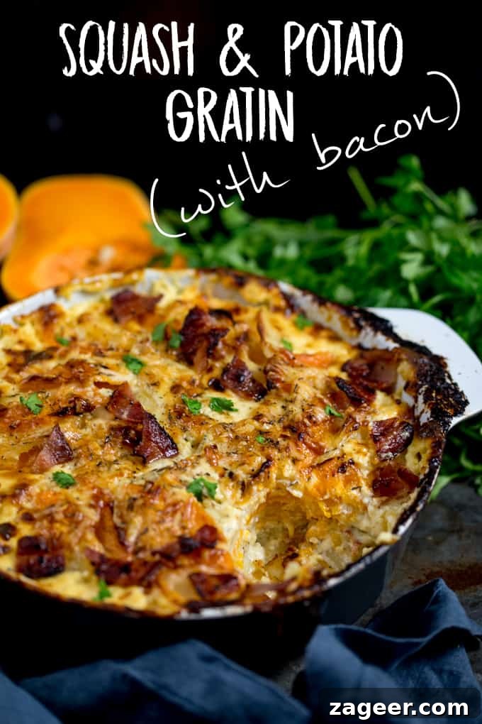 Squash and Potato Gratin in a grey and white baking dish with a scoop taken out, topped with bacon