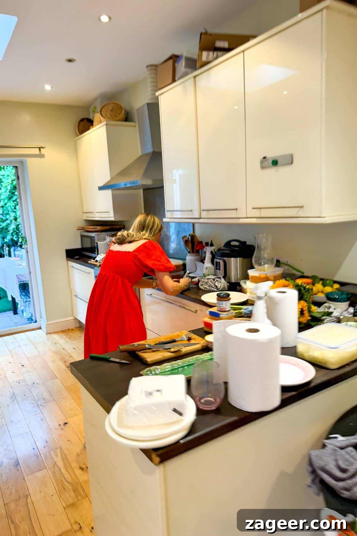 Dished by Kate's Kitchen Stocking Guide: What to Buy 5 Kate working in a kitchen.