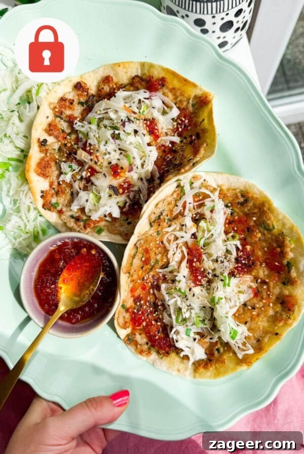 Sweet chili chicken tacos on a platter.