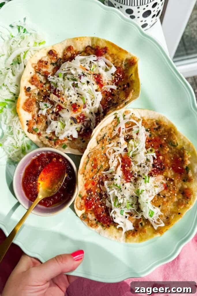 Sweet chili chicken tacos on platter.
