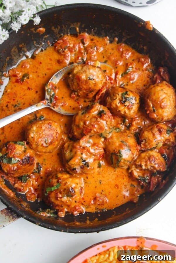 'Marry Me' chicken meatballs in sundried tomato sauce in a small pan.