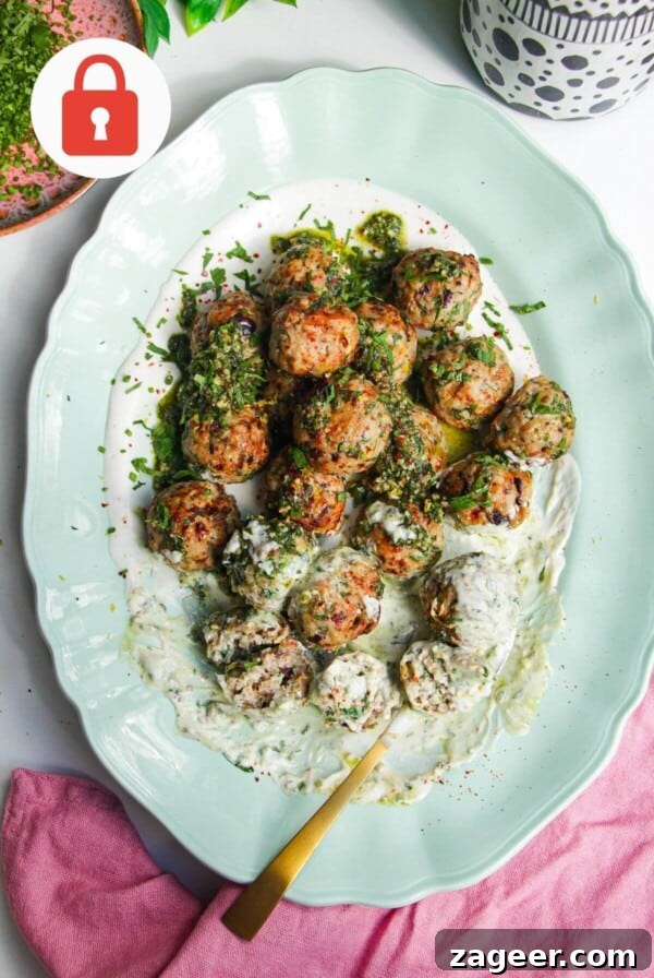 Lemon chicken meatballs on whipped feta with pesto.