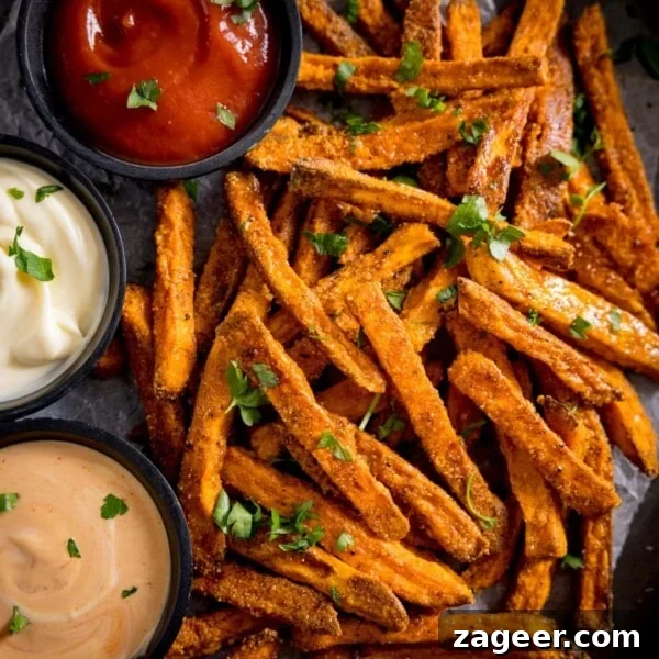 Pan Sautéed Cabbage with Garlic and Crispy Edges 12 A tall image of cooked sweet potato fries, with three colourful dips alongside.