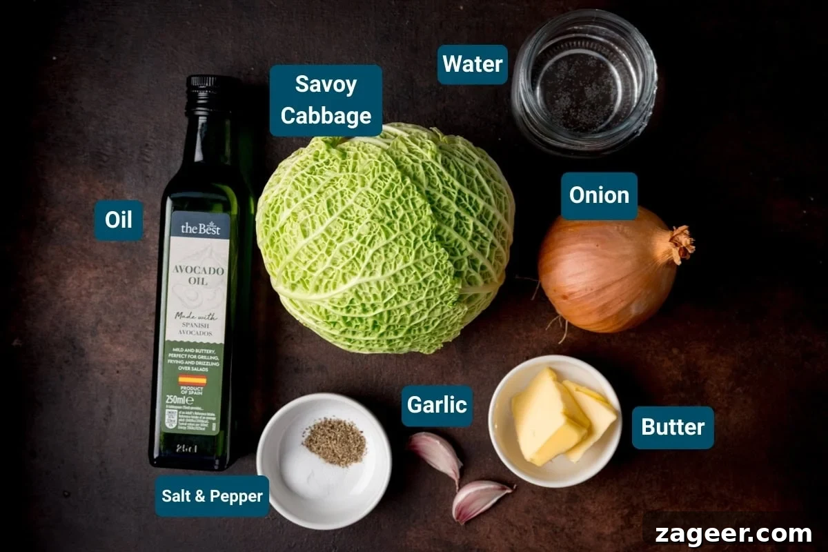 Pan Sautéed Cabbage with Garlic and Crispy Edges 4 Ingredients for sauteed cabbage on a dark background, including: A head of savoy cabbage, an onion, garlic cloves, butter, avocado oil, water, and a small dish of salt and pepper.