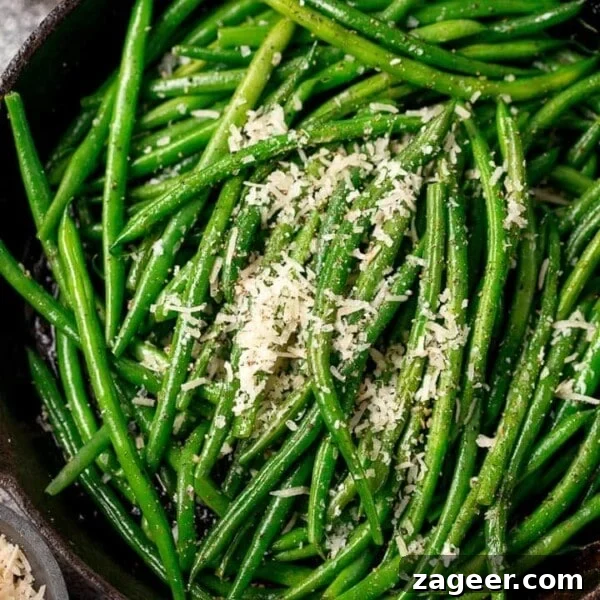 Pan Sautéed Cabbage with Garlic and Crispy Edges 9 green beans sprinkled with parmesan in a pan