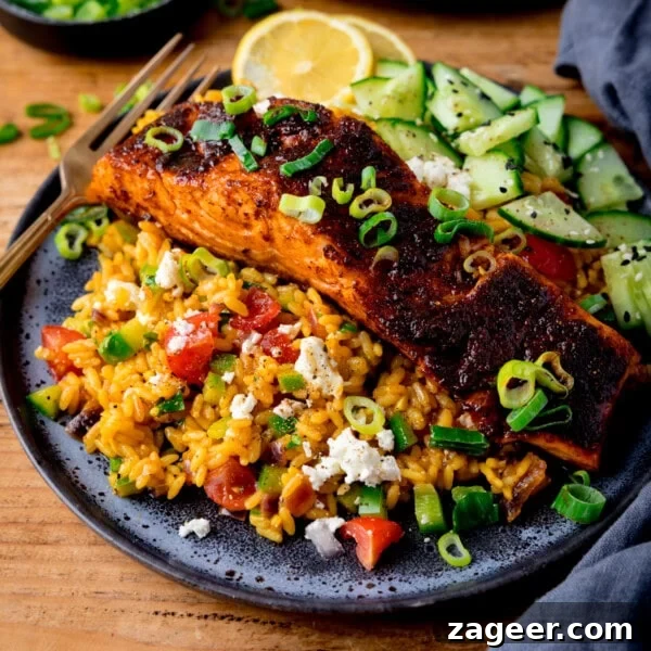 Spiced salmon fillet on vegetable rice.