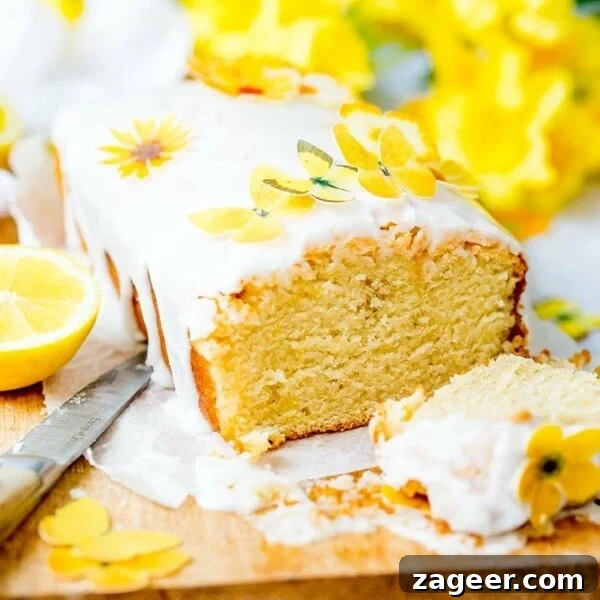 Square image of sliced open lemon drizzle cake